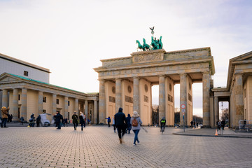 People at Brandenburg gate on Parizer Platz Street in Berlin