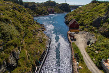 Canal between the islands in the beautiful old fishing village Rovaer in western Norway.