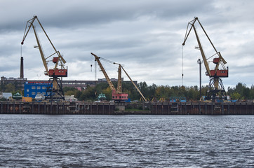 Obraz premium cargo river crane in the river port.