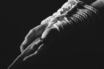 Kinbaku women's hands tied with rope © Atrom