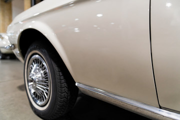 Wheel of white vintage classic car auto