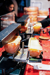 Raclette cheese in Christmas market in Germany