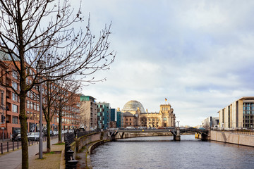 Street and Bridge at Reichstag building and German Flag Berlin