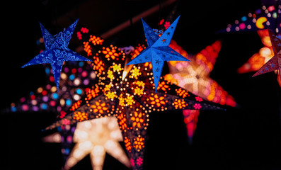 Star as Christmas tree decorations in Christmas market in Germany