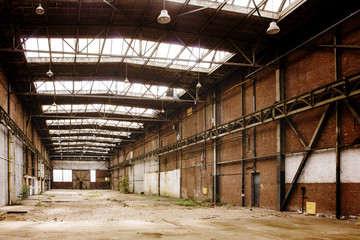Abandoned empty old factory workshop interior
