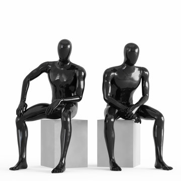 Two black plastic mannequins sit on white drawers. 3D