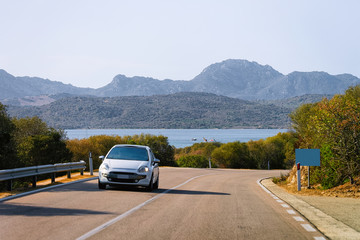 Car in road at Porto Cervo in