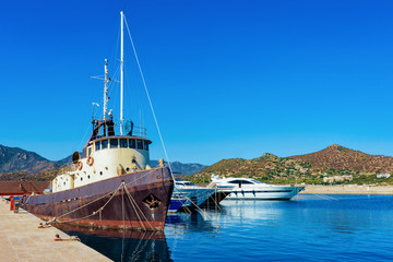 Sardinian Port with Old ship at Mediterranean Sea in Villasimius