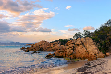 Romantic morning sunrise at Capriccioli Beach of