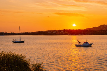 Fototapeta premium Sunrise or sunset with yachts at Porto Rotondo