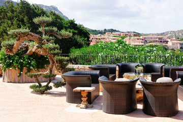 Street cafe with tables and chairs in Porto Cervo