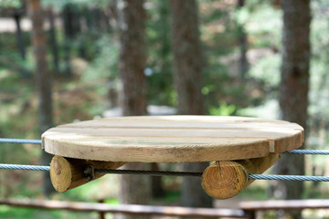 Naklejka premium Wooden platform for passing route in rope park