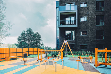 Children playground and modern residential buildings quarter