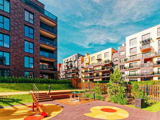 Children playground at Modern architectural complex of residential buildings