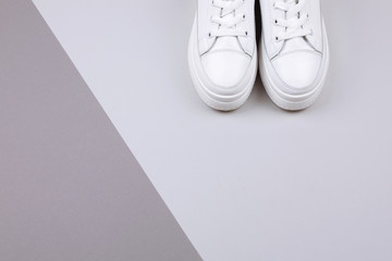 White sneakers on a gray background.