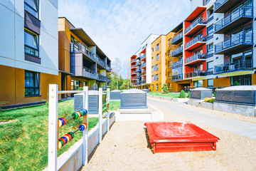 Fototapeta na wymiar Modern new house residential apartment building exterior children playground