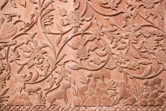 Ancient stone bas-relief with flowers and animals in Junagarh fort in Bikaner, Rajasthan, India