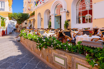 Fototapeta na wymiar Street cafe and restaurant table with chair Capri Island Italy