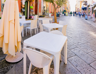 Restaurant tables on Corso Umberto I Street in Olbia