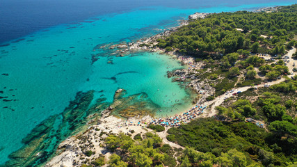 Aerial drone photo of iconic turquoise paradise rocky beach of Kavourotripes in Sithonia Peninsula, Halkidiki, North Greece