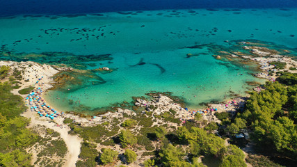 Fototapeta na wymiar Aerial drone photo of iconic turquoise paradise rocky beach of Kavourotripes in Sithonia Peninsula, Halkidiki, North Greece