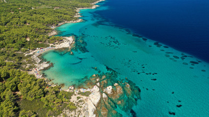 Aerial drone photo of iconic turquoise paradise rocky beach of Kavourotripes in Sithonia Peninsula, Halkidiki, North Greece