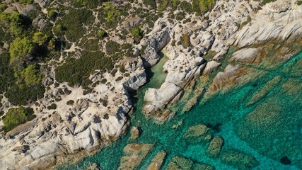 Aerial drone photo of iconic turquoise paradise rocky beach of Kavourotripes in Sithonia Peninsula, Halkidiki, North Greece