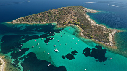 Aerial drone panoramic photo of iconic exotic bay known as blue lagoon in Diaporos island with turquoise clear sea, Vourvourou, Sithonia Peninsula, Halkidiki, North Greece © aerial-drone