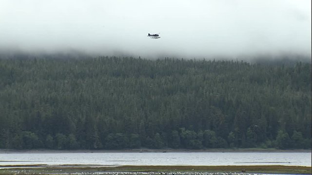 WS float plane flying in alaska bush