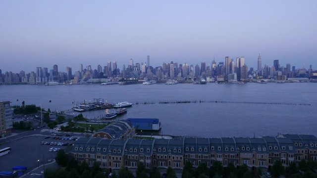 Timelipse of New york city skyline from New jersey, the end of the day and lights of the city