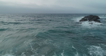 waves crashing on rocks