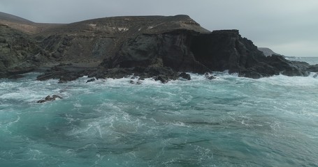 waves crashing on rocks