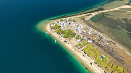 Aerial drone view of iconic Livari beach in natural exotic bay of Vourvourou, Sithonia peninsula,...