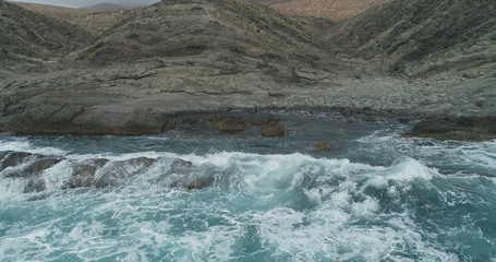 waves crashing on rocks