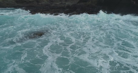 waves crashing on rocks