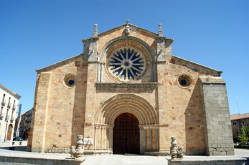 Spain, the historic city of Avila. Just outside the city walls.  The old church of St Peter the Apostle. A simple and elegant building. Rose windows, and grand entrance door.
