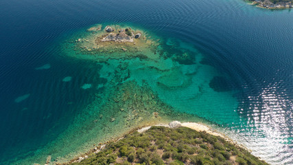 Fototapeta na wymiar Aerial drone photo of turquoise bay near famous Vourvourou and Diaporos island, Sithonia peninsula, Halkidiki, North Greece