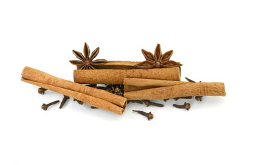 Cinnamon sticks, cloves and anise star isolated on white background close up. Spice Cinnamon sticks dried cloves and anise star.