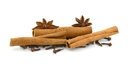Cinnamon sticks, cloves and anise star isolated on white background close up. Spice Cinnamon sticks dried cloves and anise star.