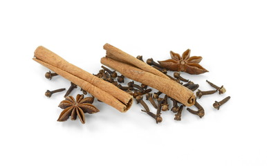 Cinnamon sticks, cloves and anise star isolated on white background close up. Spice Cinnamon sticks dried cloves and anise star.