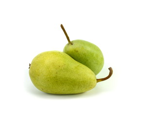 Green organic pears on white background