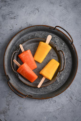 Papaya and mango popsicle