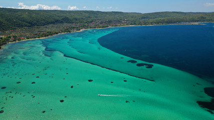 Aerial drone panoramic photo of iconic bay with turquoise frozen waves of Vourvourou in Sithonia...