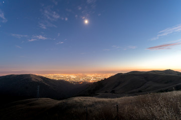 Aerial View of Downtown San Jose At Night With Moon High in the Sky