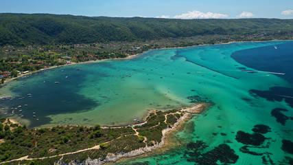 Naklejka premium Aerial drone panoramic photo of iconic bay with turquoise frozen waves of Vourvourou in Sithonia Peninsula, Halkidiki, North Greece
