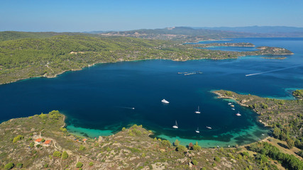 Obraz premium Aerial drone panoramic photo of iconic bay with turquoise frozen waves of Vourvourou in Sithonia Peninsula, Halkidiki, North Greece