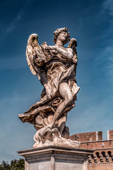 Fototapeta na wymiar Ancient angel sculpture in Rome, Italy