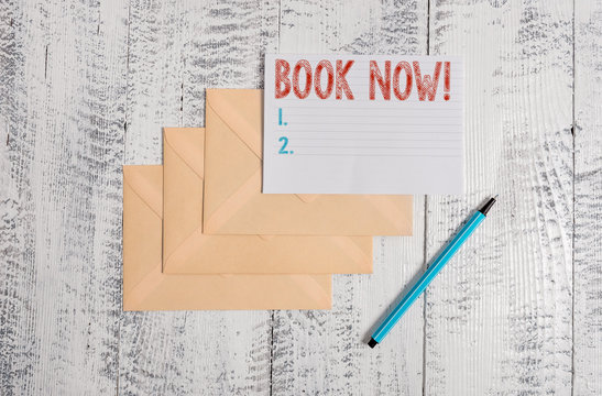 Text sign showing Book Now. Business photo showcasing guaranteed to have place because you have already purchased it Three envelopes marker ruled paper sheet old wooden vintage background