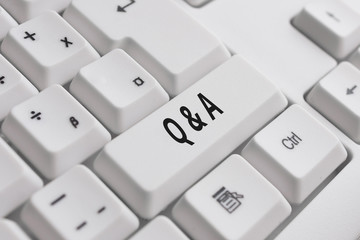 Writing note showing Q And A. Business concept for a period of time or an occasion when someone answers questions White pc keyboard with note paper above the white background