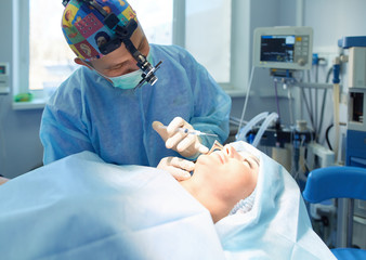 Man surgeon at work in operating room